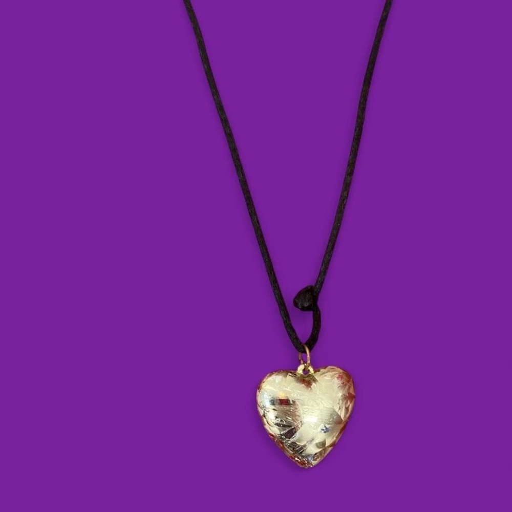 Silver tone heart pendant necklace on black cord #heartjewellery